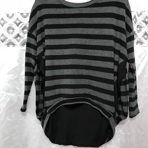 Asymmetrical grey and black long sleeved shirt